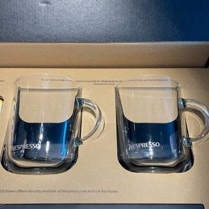 Two Nespresso glass coffee cups.